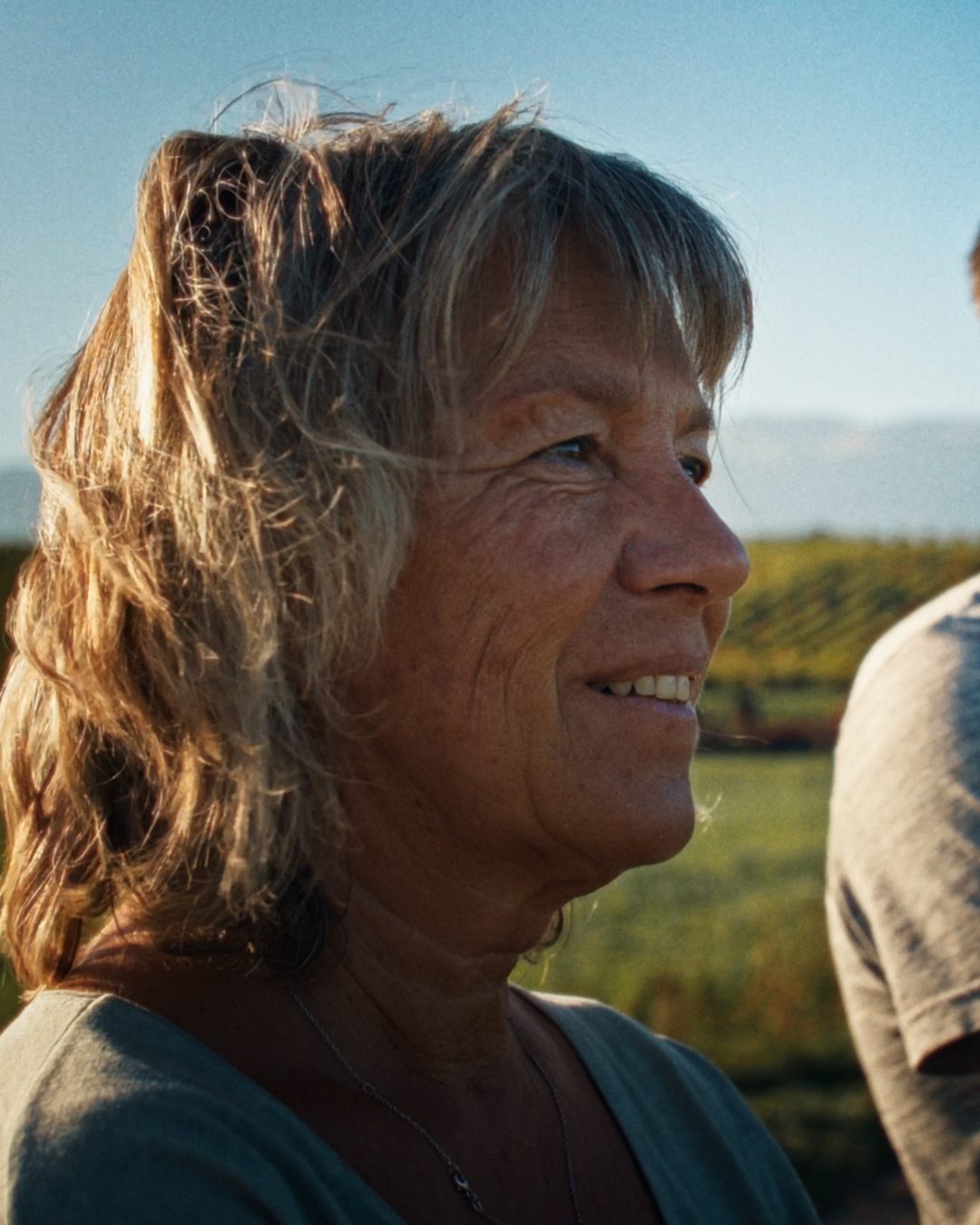 A woman smiling in the evening light